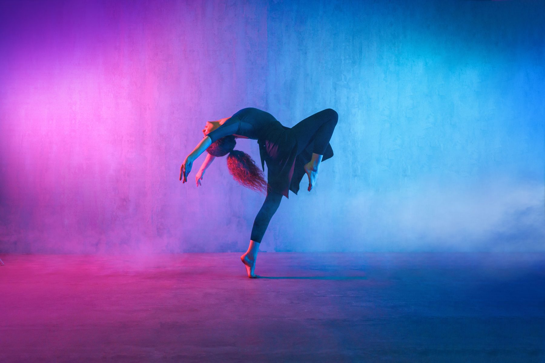 Dancer performing in a dramatic studio portrait