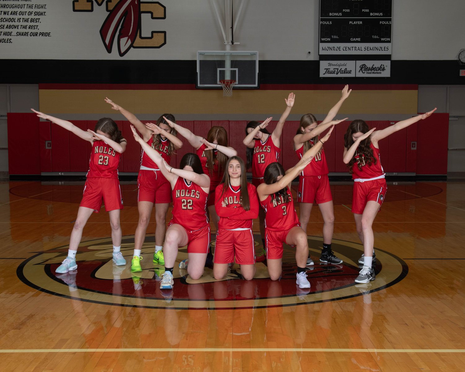 Youth basketball team on the court at a DLS Innovations league picture day